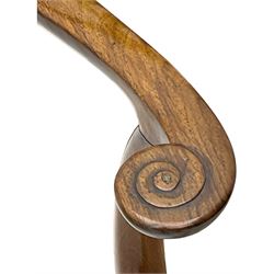 George III walnut elbow chair, shaped cresting rail over shaped pierced splat, the shaped arms with scroll carved terminals, upholstered drop in seat, on square chamfered supports united by plain stretchers 