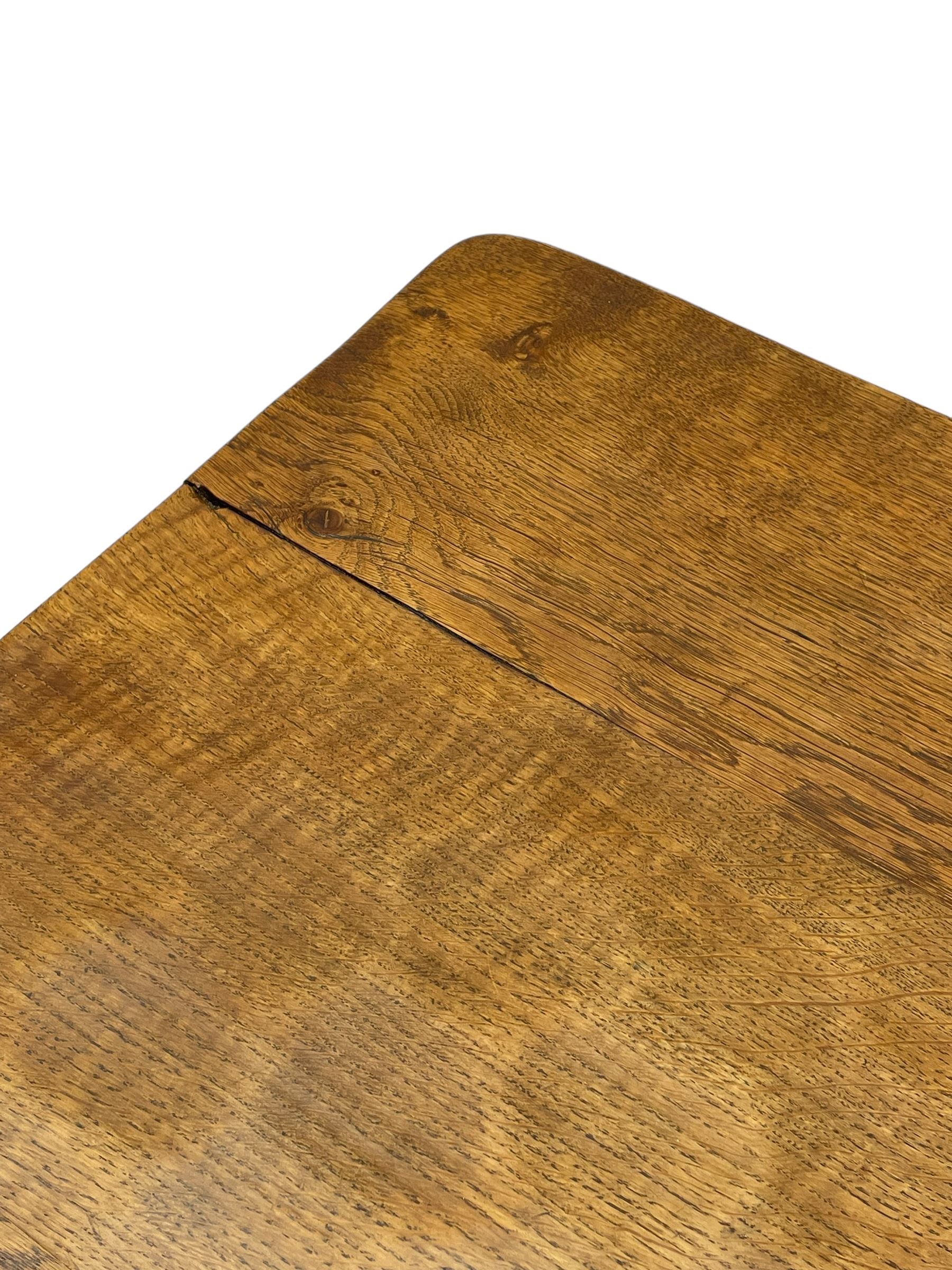 Gnomeman - oak dining table, rectangular adzed top, shaped end supports on sledge feet united by pegged stretcher, by Thomas Whittaker, Littlebeck, Whitby 