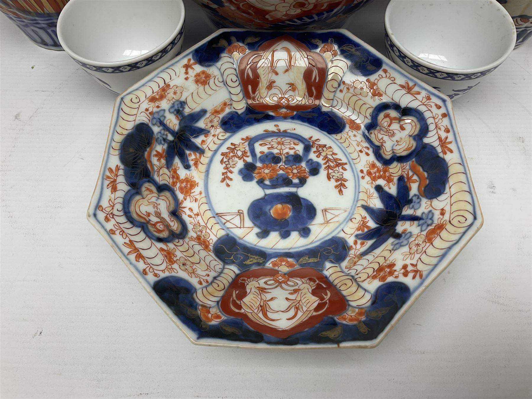 Pair of Japanese Imari vases with floral decoration, together with two Imari shell dishes etc, vases H24cm