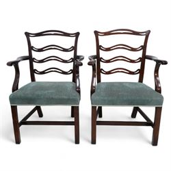 Set of six (4+2) Chippendale Revival stained beech dining chairs, pierced waived ladder backs with over-stuffed seats, on square moulded supports joined by stretchers