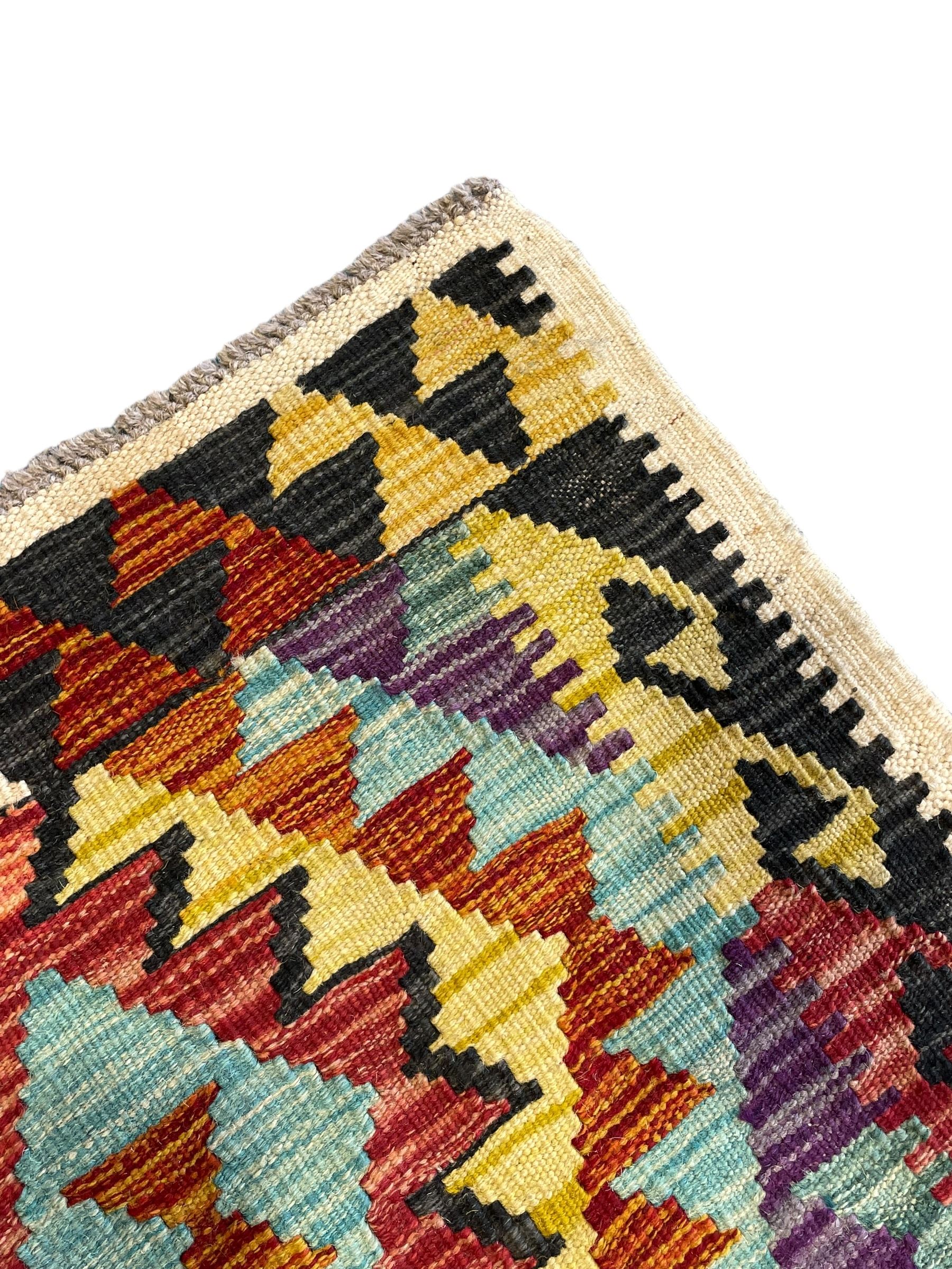 Chobi Kilim ivory ground runner rug, the field decorated with four multi-coloured lozenges, each with central geometric decoration, within concentric lozenges, enclosed by hooked border