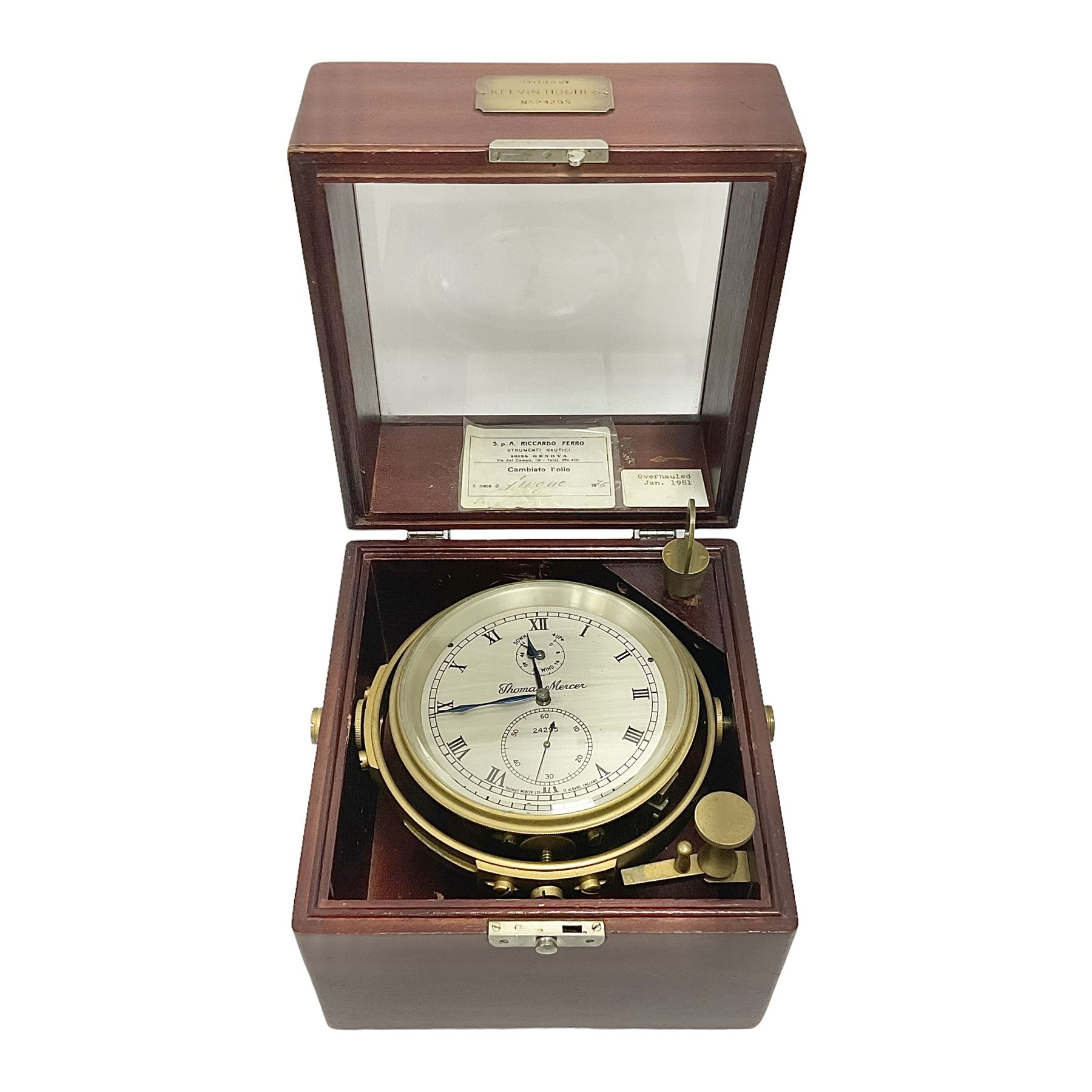 Two-day marine chronometer, with silvered dial inscribed Thomas Mercer Ltd, St Albans, contained within a brass gimbal-mounted bowl and glazed mahogany case, with applied brass plaque reading 'supplied by Kelvin Hughes no. 24295', brass winding key and two service notes to interior of case, dial D12cm, wooden case H17.5cm 