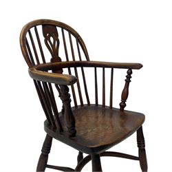 19th century yew wood and elm Windsor armchair, low double hoop stick and pierced splat back, dished seat on turned supports united by crinoline stretchers