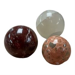 Collection of three stone spheres including Leopardite example