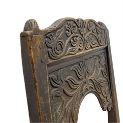 Set of three 18th century carved oak back stools, the cresting rail carved with scrolling foliate motifs over an arched panel with a stylised tree carving with extending leafage, the panelled seat held within a bobbin-turned frame, raised on turned supports united by a ring-turned front stretcher