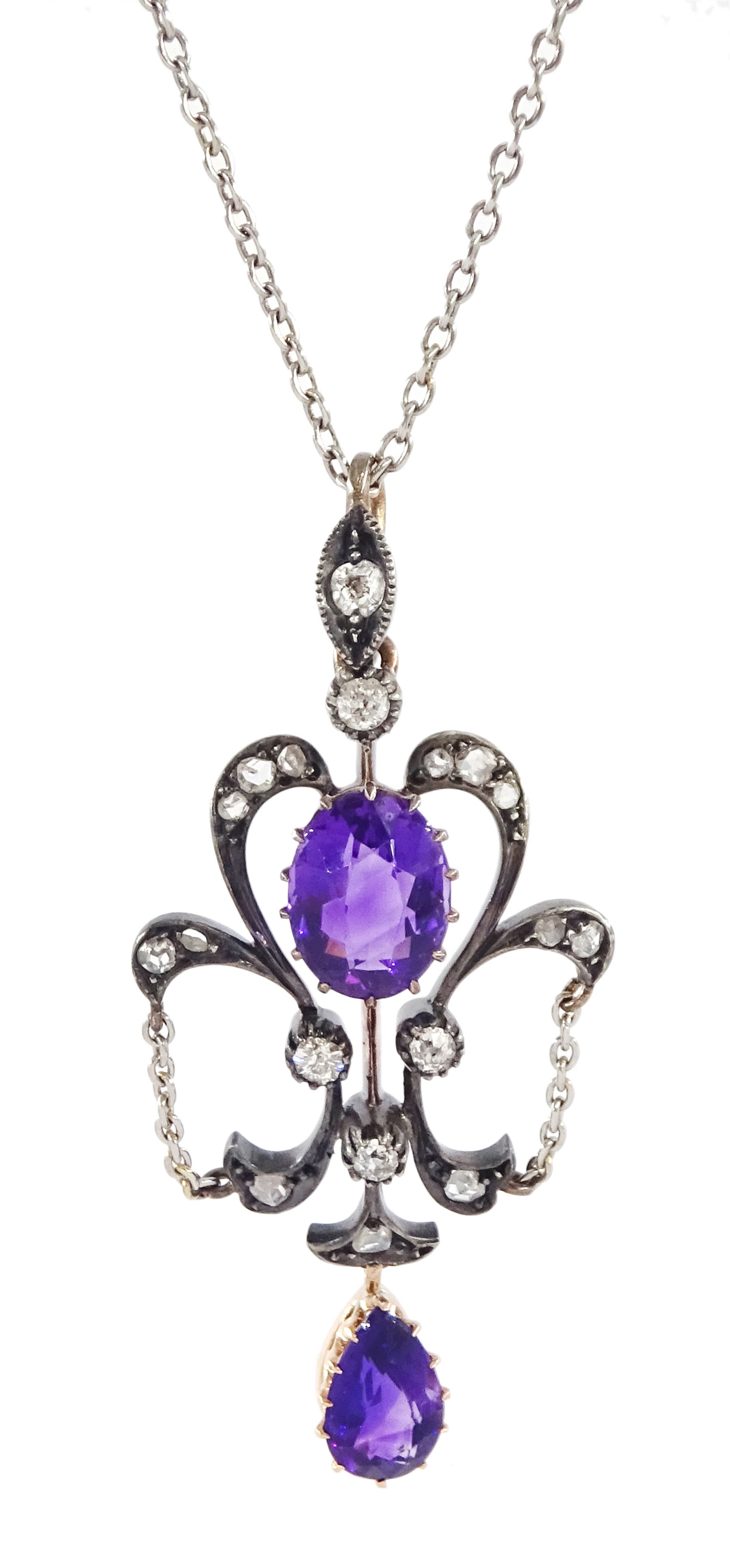 Edwardian silver, gold and platinum amethyst and diamond pendant, oval cut amethyst with old cut and rose cut diamond surround, suspending a pear cut amethyst, on platinum trace link chain necklace