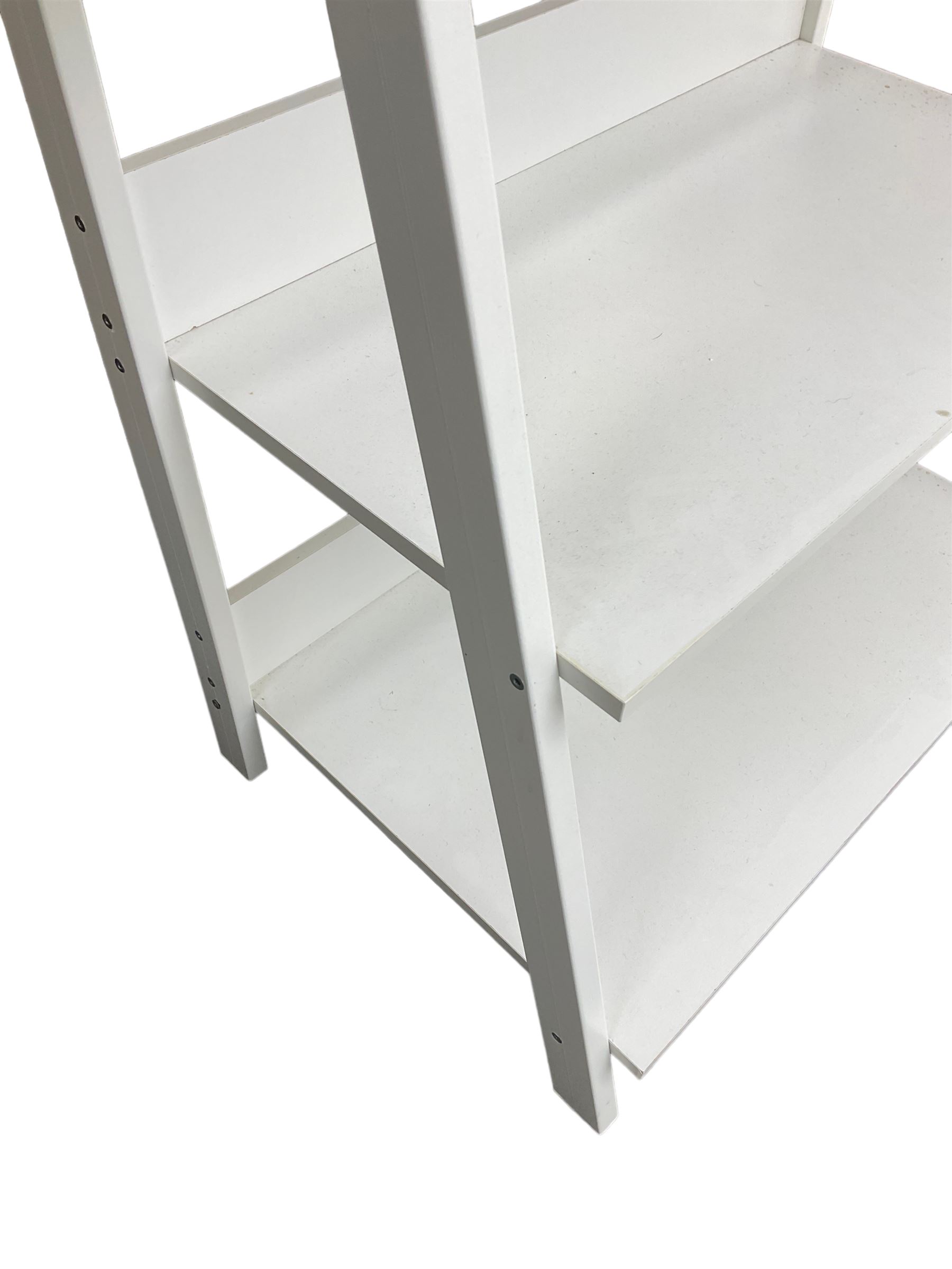 Contemporary white finish shelving unit, five graduating sloped shelves