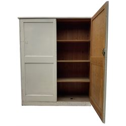 Large Victorian white painted pine cupboard, enclosed by two panelled doors 