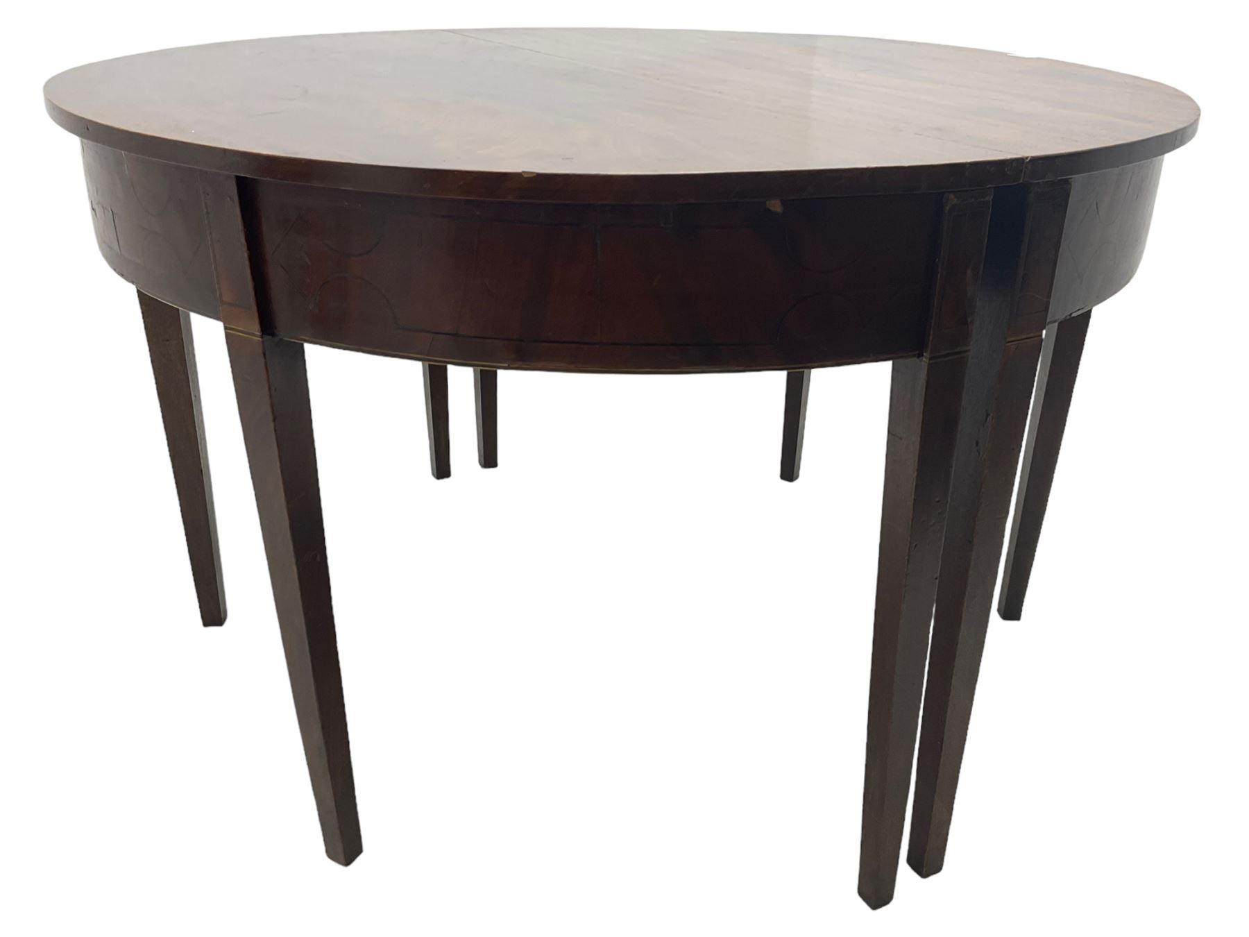 Regency mahogany D-ended extending dining table, circular top with banded fireze inlaid with ebony stringing, raised on square tapering supports, with two additional leaves, supported by gate-leg central action