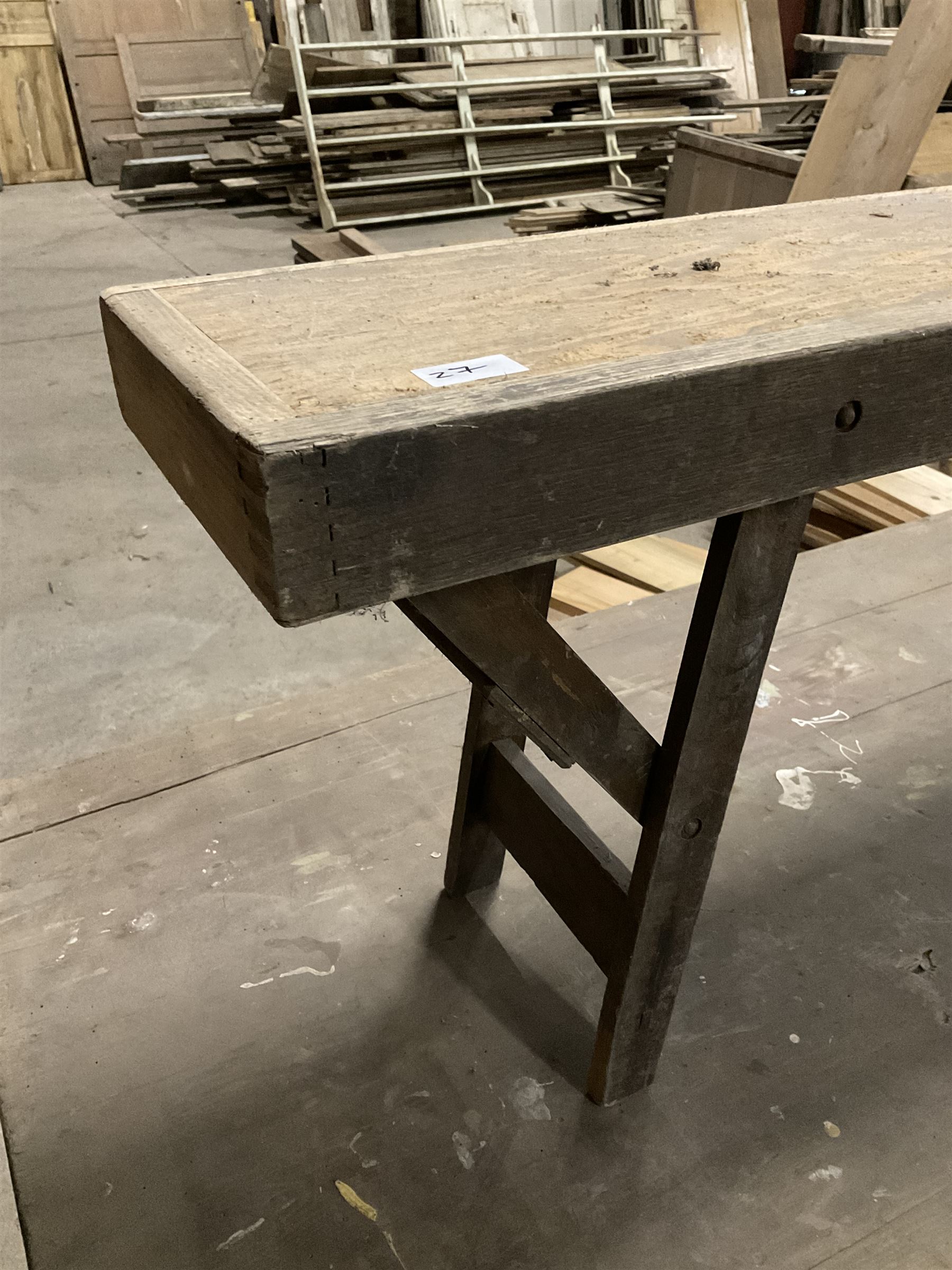 20the century pine folding table, rectangular top on square supports joined by stretchers (244cm x 68cm, H76cm); together with a similar folding bench (181cm x 25cm, H43cm) - THIS LOT IS TO BE COLLECTED BY APPOINTMENT FROM THE OLD BUFFER DEPOT, MELBOURNE PLACE, SOWERBY, THIRSK, YO7 1QY