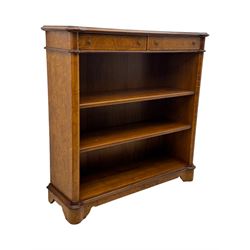 Figured walnut open bookcase, moulded top over two drawers and two shelves, on plinth base 