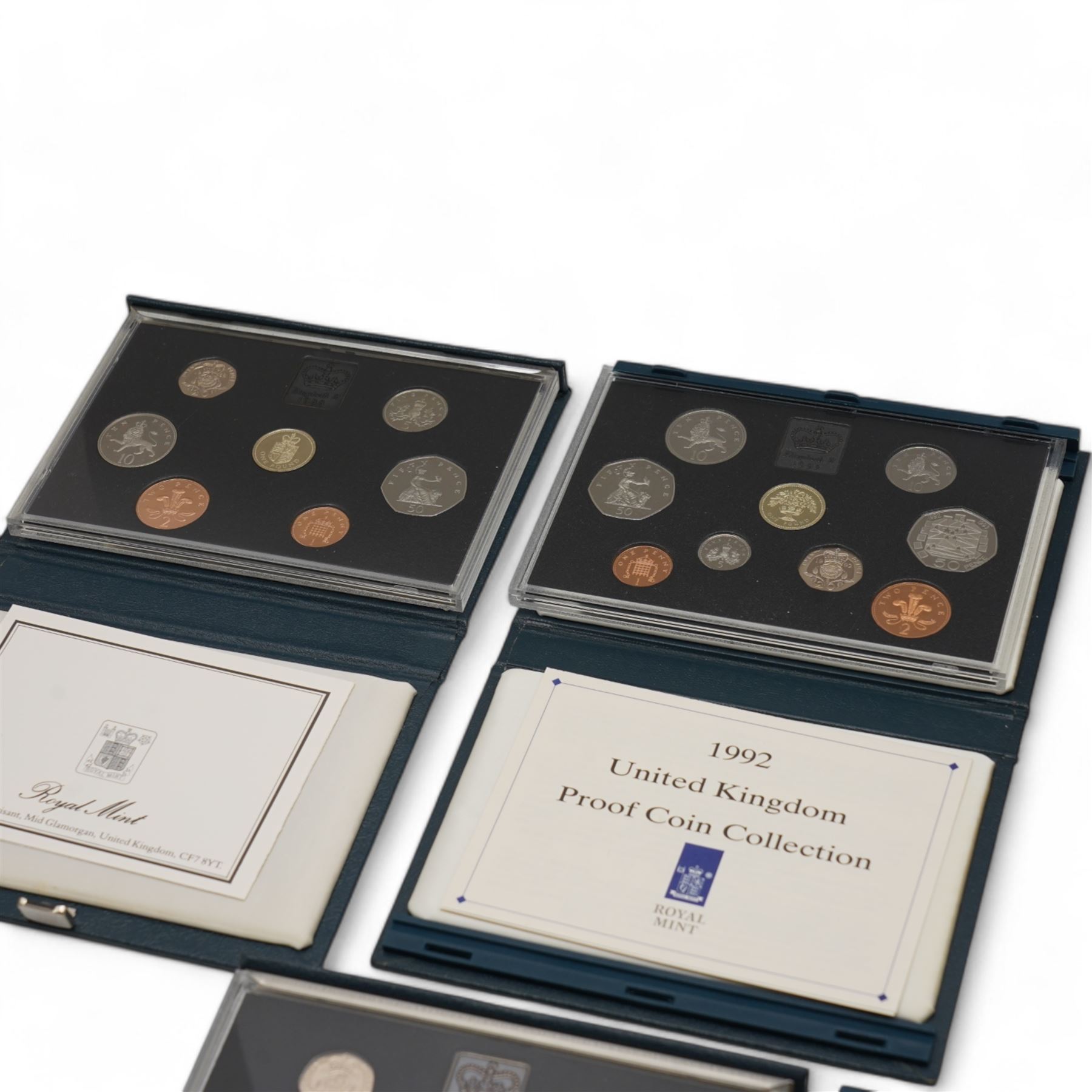 Eleven The Royal Mint United Kingdom proof coin collections, dated 1985, 1986, 1987, 1988, 1990, 1992 with dual dated fifty pence, 1994, 1996, 1999, 2001 and 2003, all cased with certificates