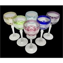 Set of six Harlequin coloured glass hock glasses, each with a band of hobnail decoration, upon faceted stems, H19.5cm