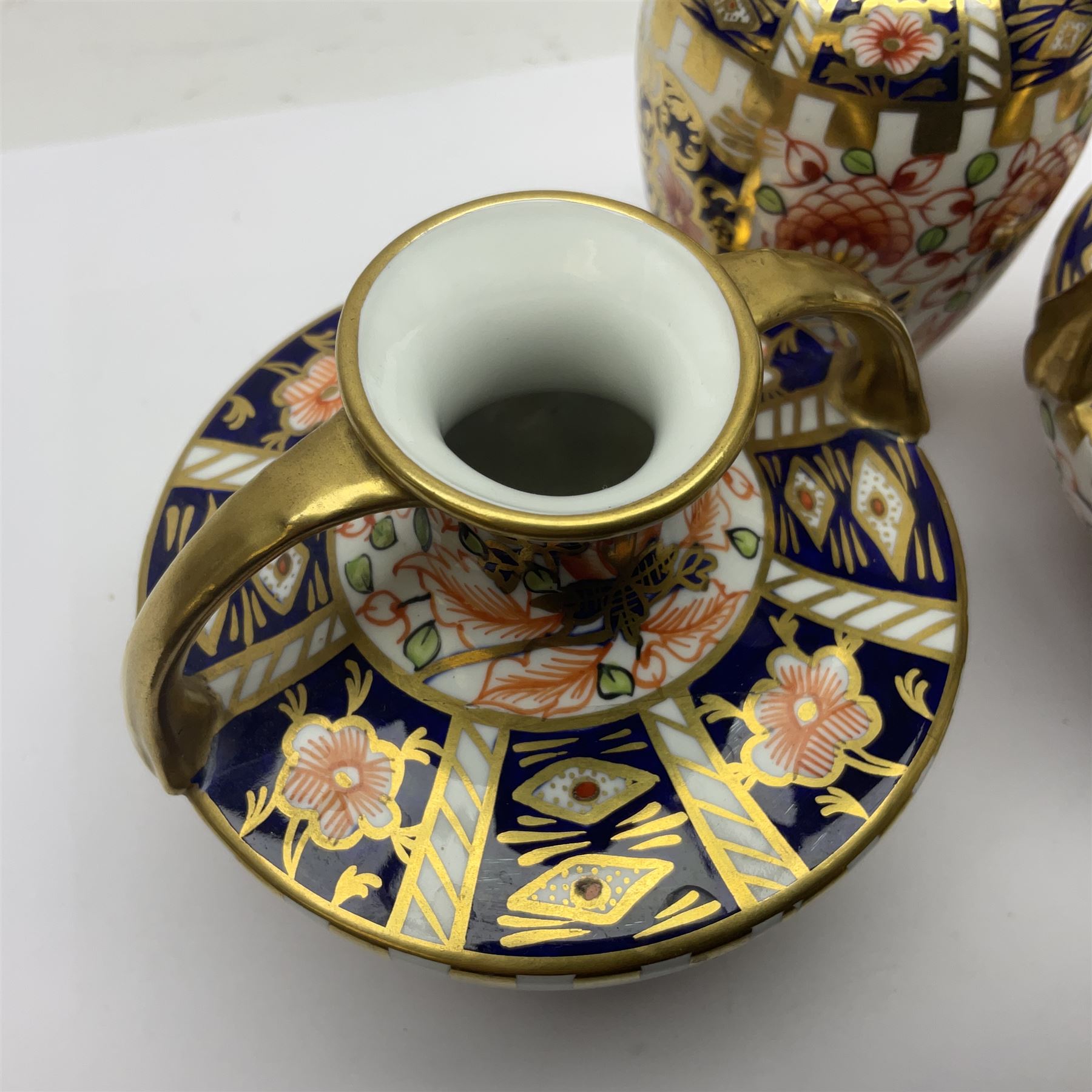 Pair of Royal Crown Derby 6299 imari miniature two-handled vases, together with another miniature vase of baluster form, all with printed mark beneath, tallest H8cm 