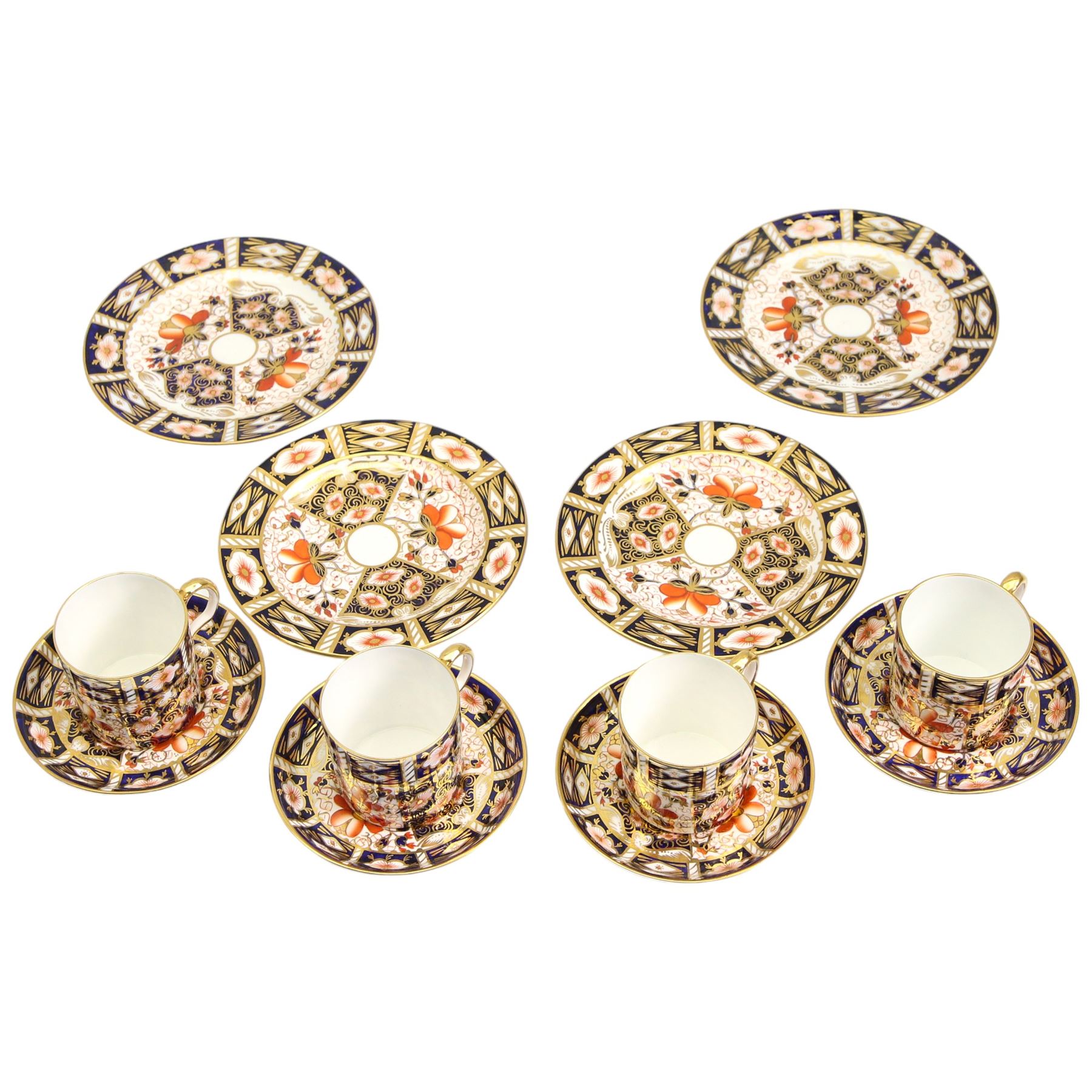 Set of four Royal Crown Derby Imari pattern coffee cans and saucers, pattern 2451and a set of four matching plates D15cm