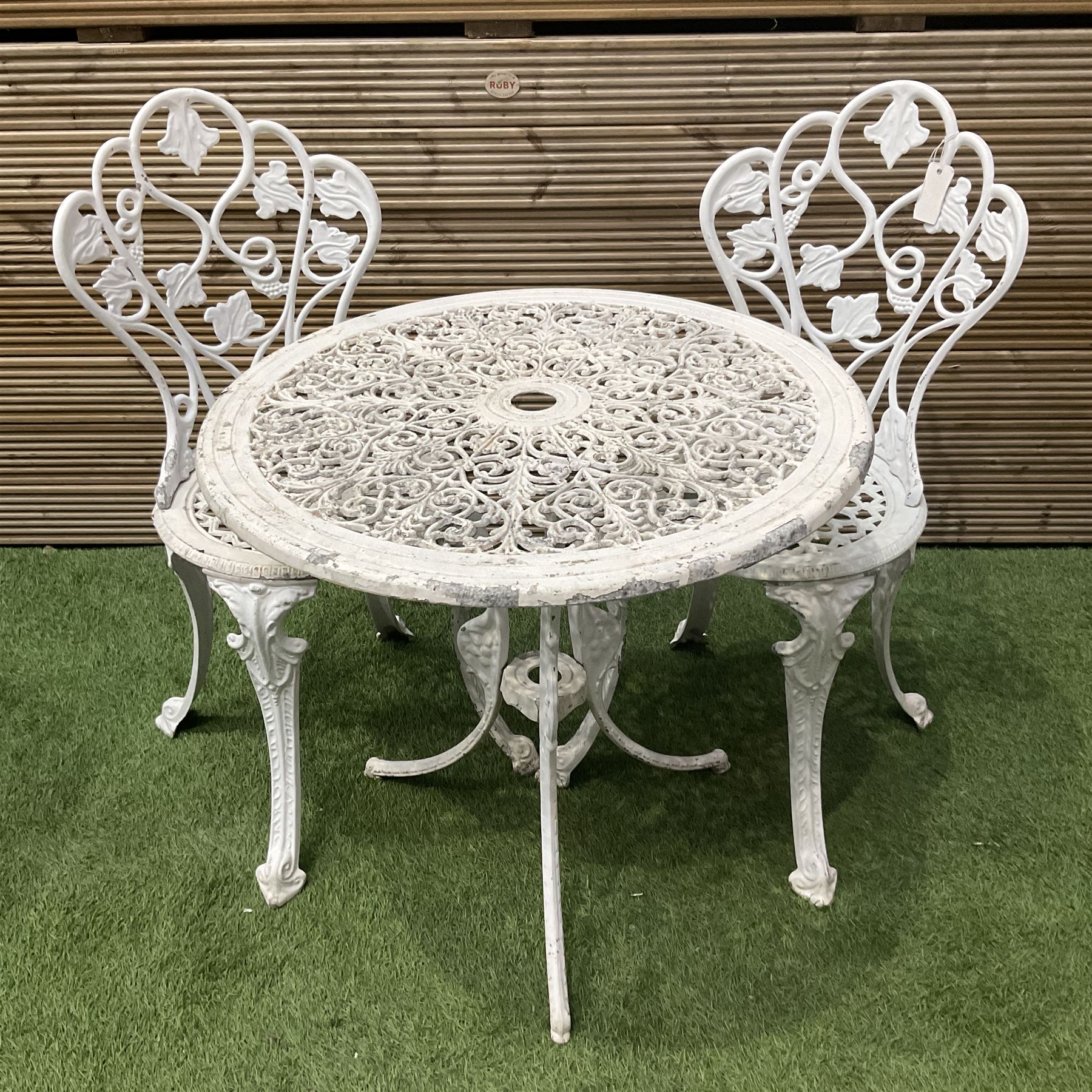 Cast aluminium white painted garden table and two chairs  - THIS LOT IS TO BE COLLECTED BY APPOINTMENT FROM DUGGLEBY STORAGE, GREAT HILL, EASTFIELD, SCARBOROUGH, YO11 3TX