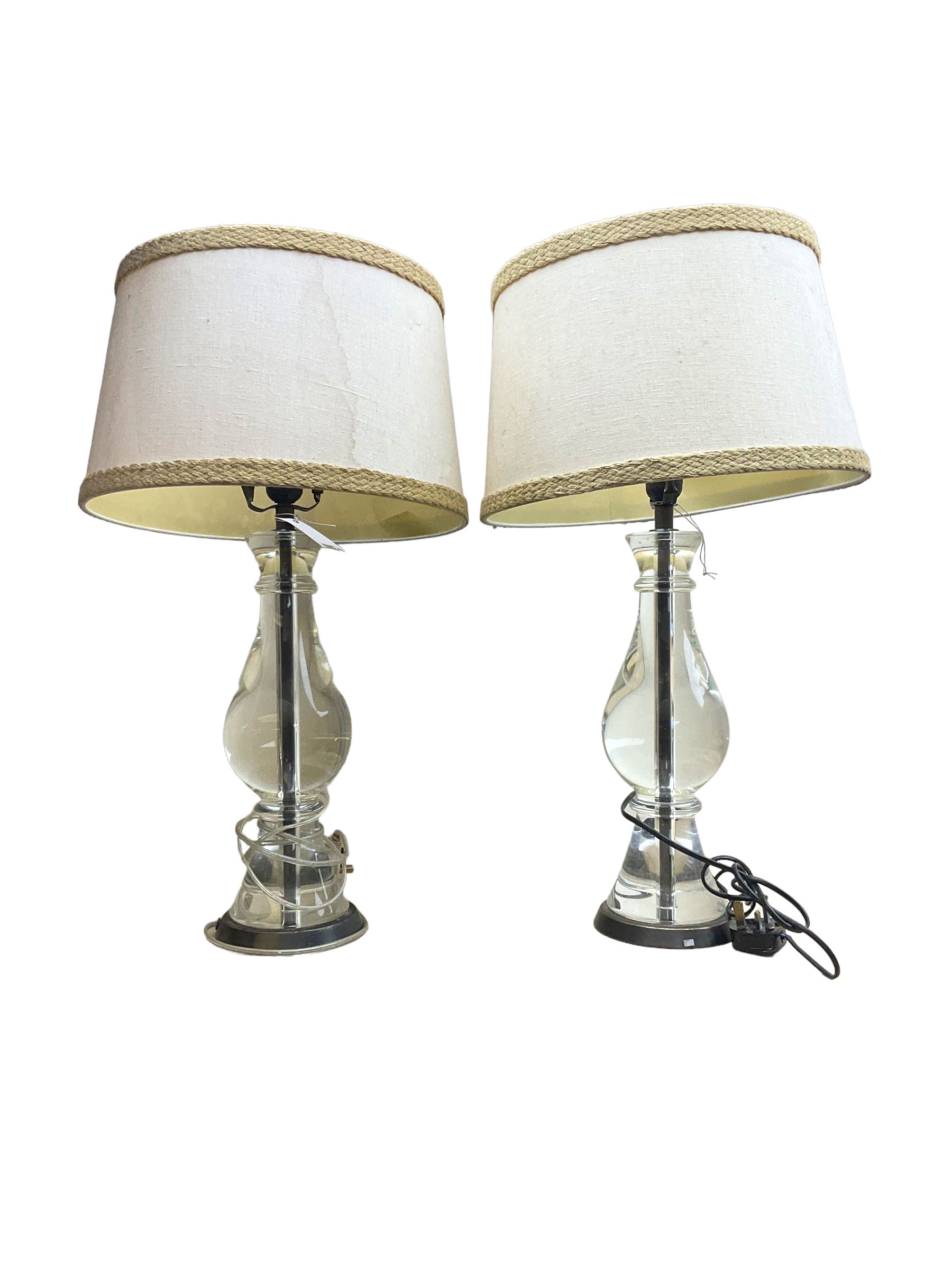 Pair of large clear resin table lamps, of baluster form with cream hessian shades, overall approximately H70cm