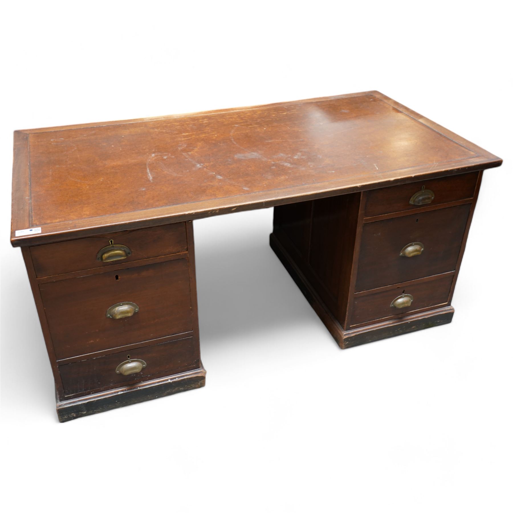 Early 20th century mahogany twin pedestal desk, rectangular top with brown leather inset, fitted with six drawers with brass cup handles, moulded plinth base