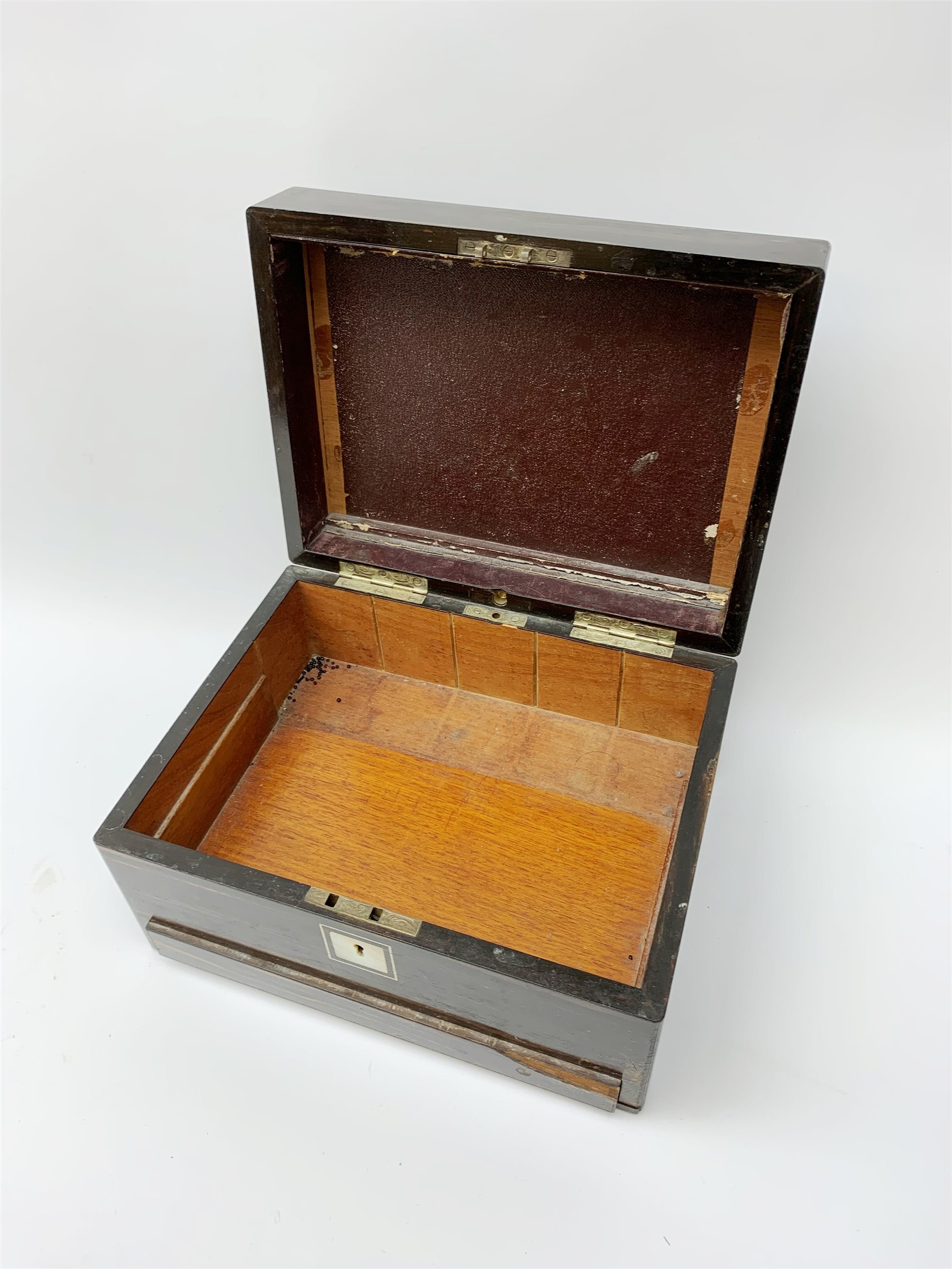 A Victorian coromandel box, with inset mother of pearl panel to the hinger opening cover, mother of pearl escutcheon, and secret drawer beneath, (lacking interior), H17cm L30cm D22.5cm.   