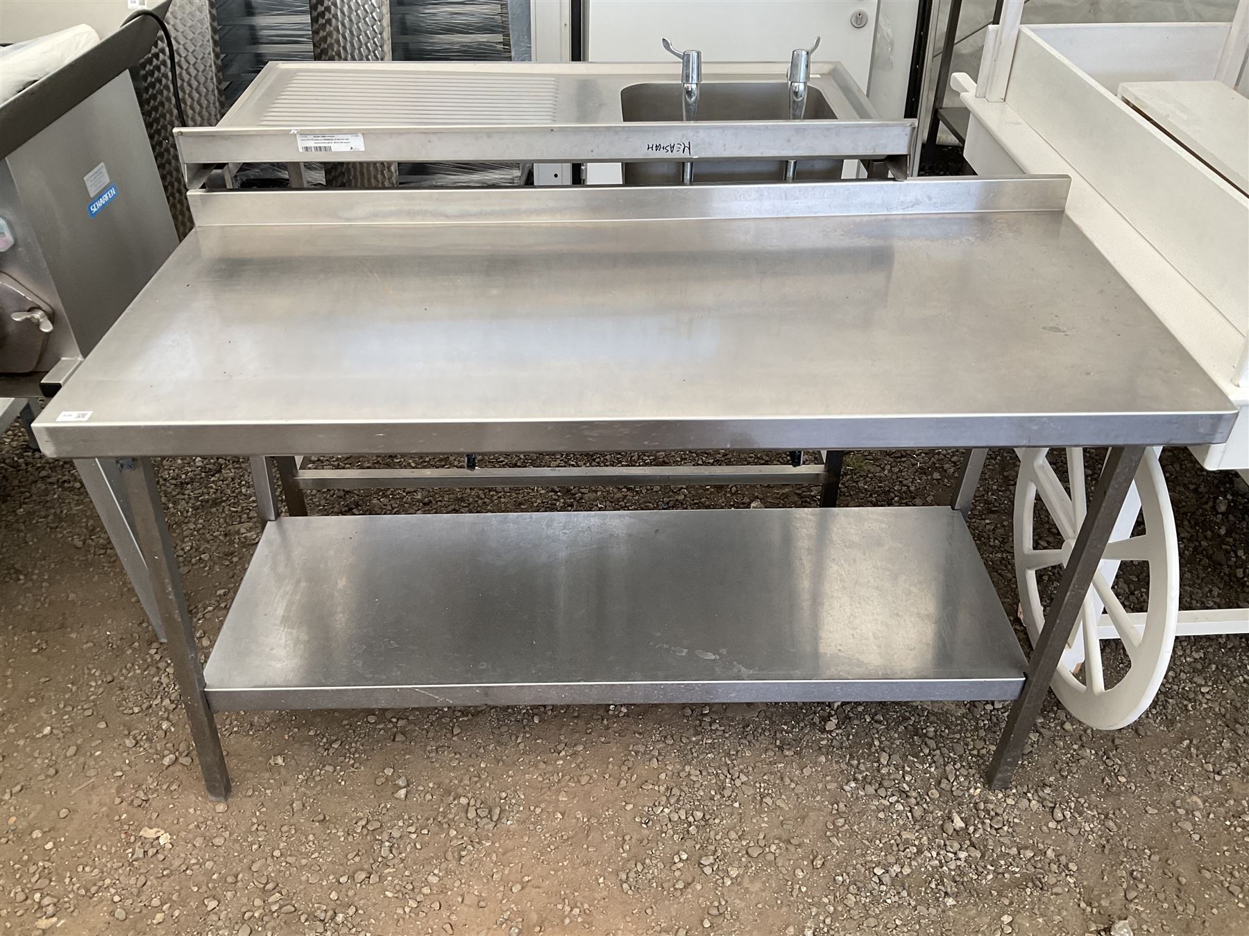 Stainless steel two tier preparation table - movement in legs - THIS LOT IS TO BE COLLECTED BY APPOINTMENT FROM DUGGLEBY STORAGE, GREAT HILL, EASTFIELD, SCARBOROUGH, YO11 3TX