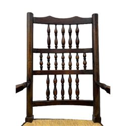 Matched set of twelve 19th century elm Lancashire spindleback dining chairs, shaped cresting rail over spindle back, rush seat, on turned supports united by turned stretchers, ring and globular turned front stretcher 