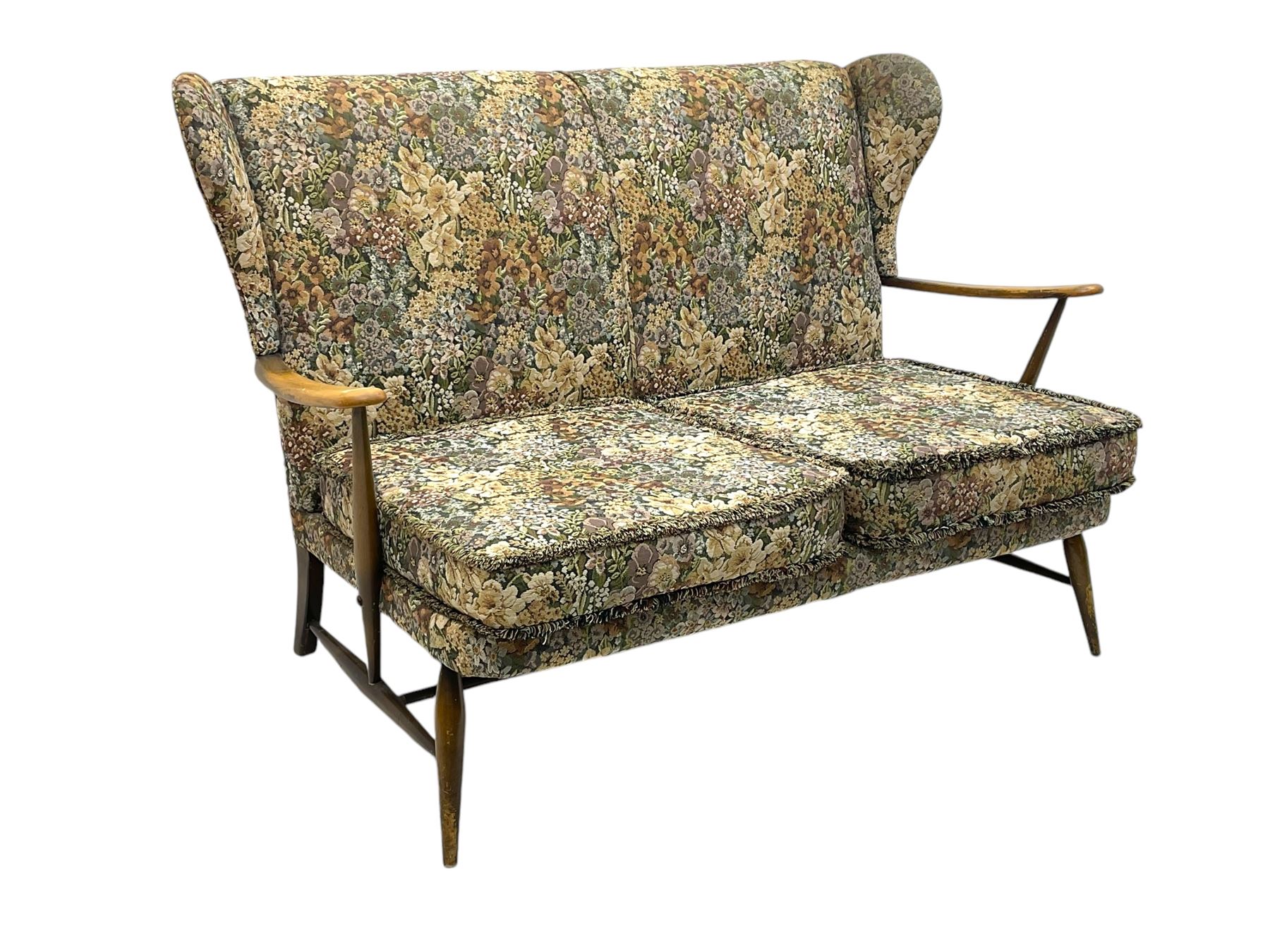 Lucian Ercolani for Ercol - mid-20th century beech and elm 'Windsor 203' two-seat sofa, wingback design upholstered in floral pattern over sprung seat and backrest, open curved arms, on splayed supports with stretchers (W133cm, D87cm, H90cm); matching easy chair (W70cm, D97cm, H82cm)