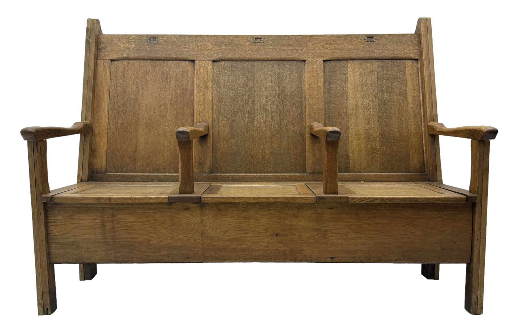 Early 20th century oak settle, featuring a high back with three panel sections and hinged lids, the bench seat divided into three sections, each with its own armrests, supported by square legs