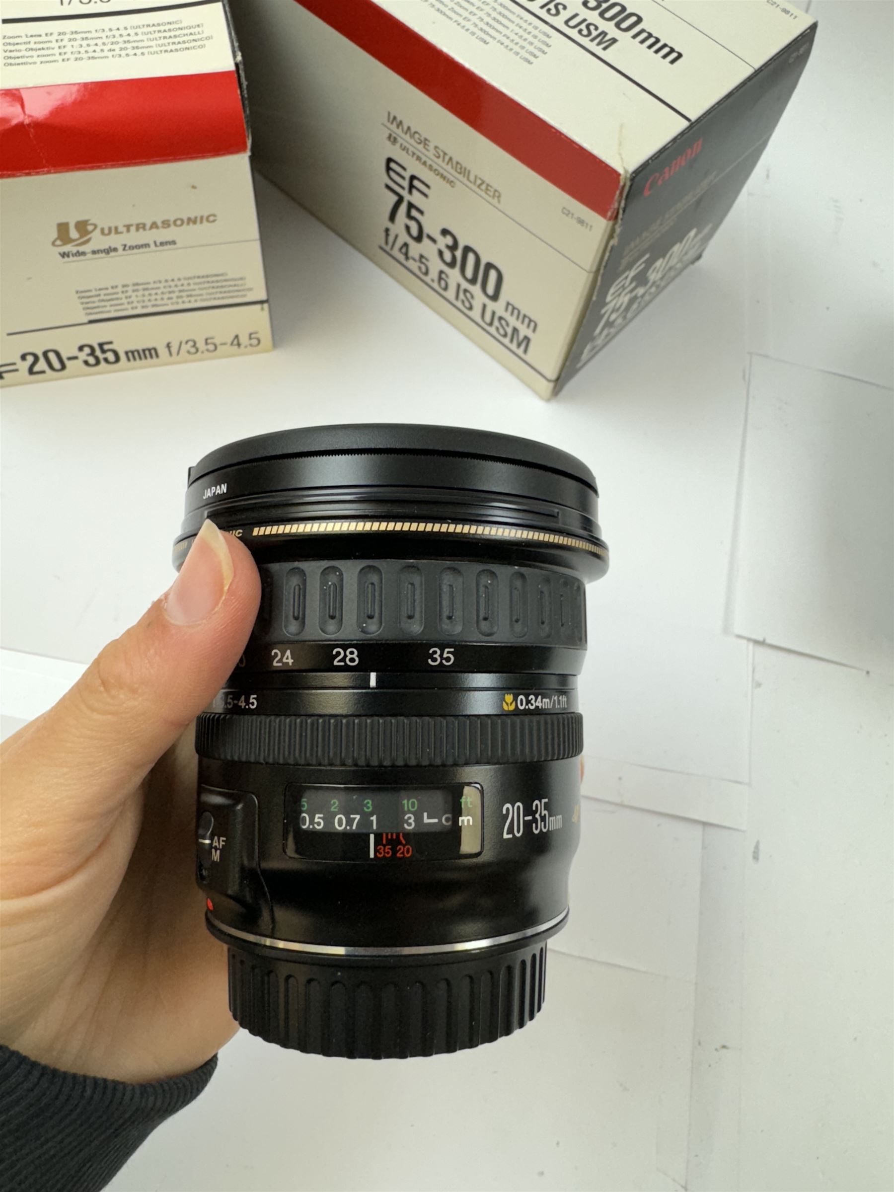 Two Canon Ultrasonic EF camera lenses, comprising 20-35mm 1:3.5-4.5 zoom lens serial no. 7800971F and 75-300mm 1:4-5.6 Image Stabiliser lens serial no. 6200116H, both boxed 