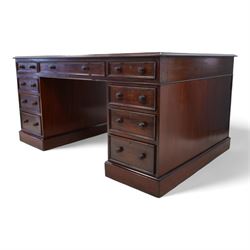 Victorian mahogany twin pedestal desk, moulded rectangular top with leather inset, one side fitted with nine drawers, the opposing side fitted with three drawers and two cupboards, two panelled doors enclosing further drawers, on moulded plinth base 