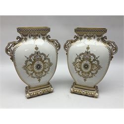 Pair of Copelands enamel jeweled twin handle vases, each decorated with a seated female figures, makers mark beneath, H22cm