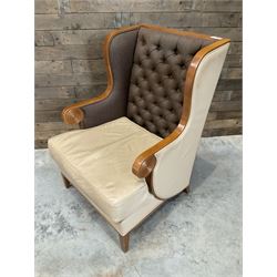 Walnut finish framed wing back armchair upholstered leather and buttoned fabric