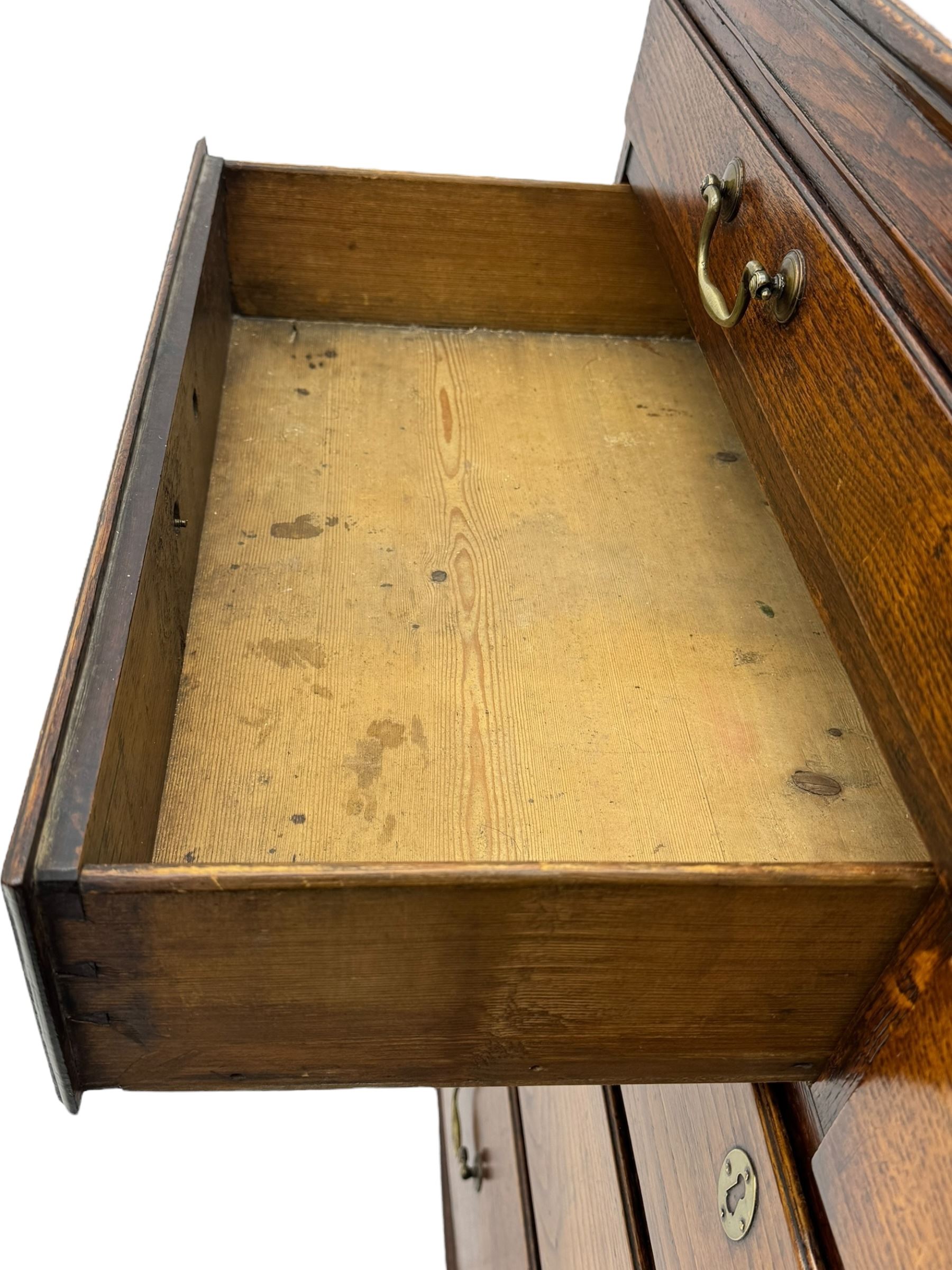 George III oak chest, rectangular top over frieze with inlaid with inscription panels 'Mary Rees' and fan motifs, frieze drawer over two short and three long graduating drawers, fitted with brass swan-neck handles and oval escutcheons, on bracket feet