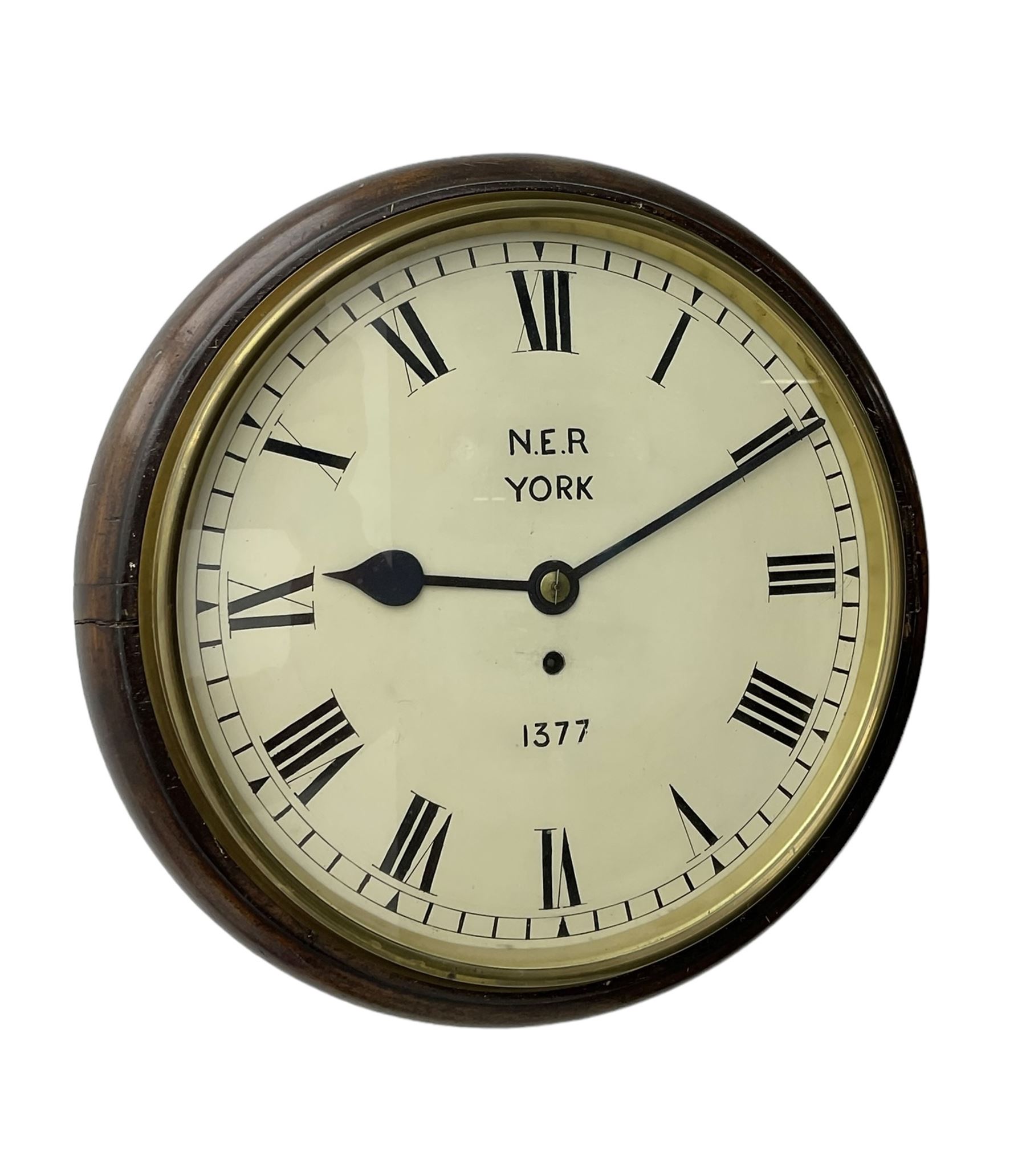 English - 8-day single train Fusee wall clock, with a mahogany dial surround and brass bezel, painted dial with Roman numerals , minute track and steel spade hands, dial inscribed N.E.R. YORK .1377. wire driven fusee with square plates and recoil anchor escapement. With pendulum. 