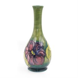 Moorcroft vase of tear drop form, decorated in Clematis pattern on a green ground, makers mark and label beneath, H27cm