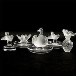 Lalique glass to include three pin dishes surmounted with swans, lovebirds and wren, another figure of a wren on circular base and a Nina Ricci dove perfume bottle, H9cm (5)