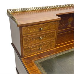 Edwardian inlaid mahogany writing desk, raised galleried back over inlaid central urn with scrolling leafy branches and six small drawers, satinwood banded rectangular moulded top with tooled leather inset, fitted with five drawers, the drawer facias inlaid with scrolling foliage and satinwood banding, square tapering supports inlaid with trailing bell flowers, on brass and ceramic castors 