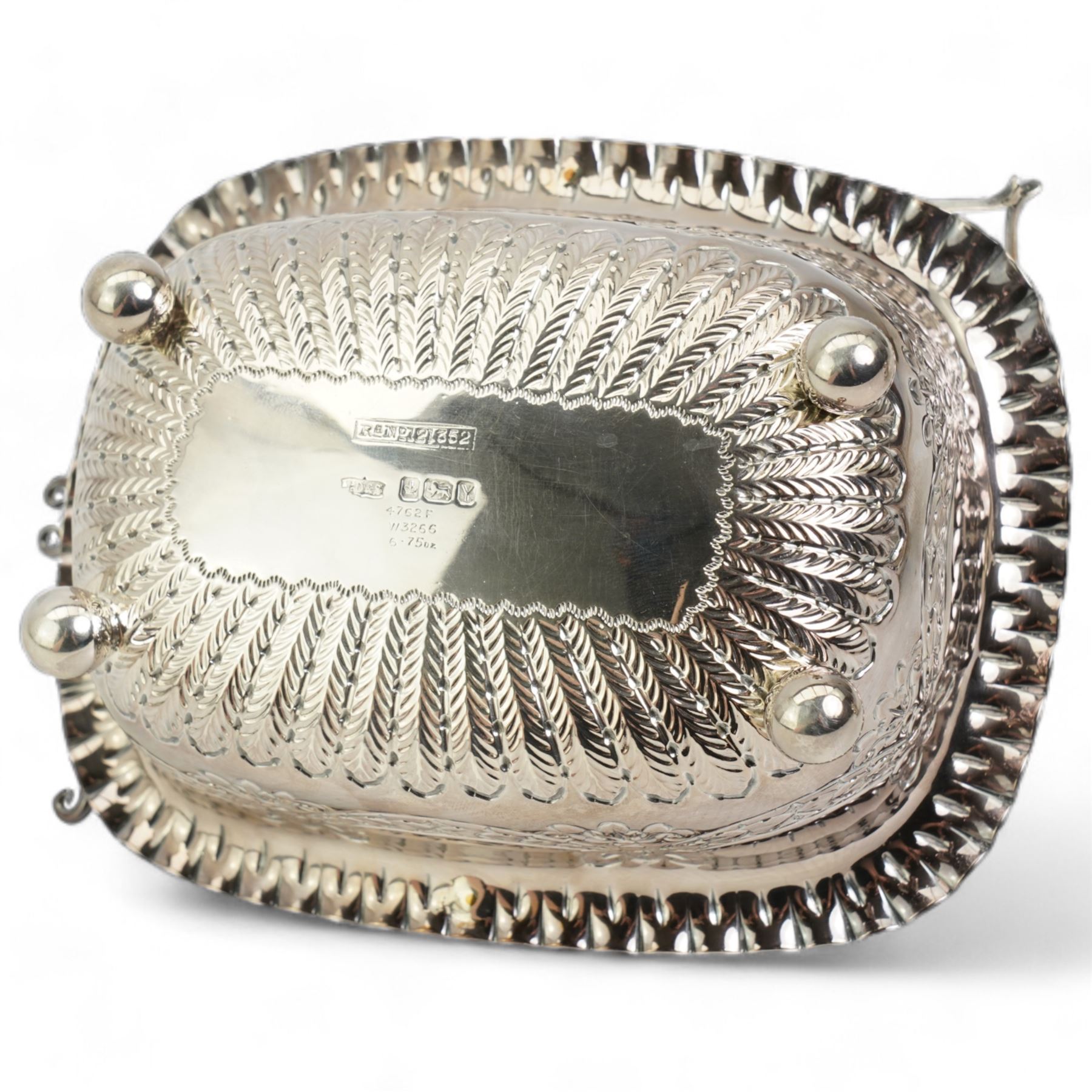  Victorian silver rectangular sugar basket with swing handle decorated with garlands and foliage on ball feet W15cm Sheffield 1891 Maker James Dixon & Son and a silver cream jug and sugar bowl Chester 1919 