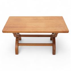 Rabbitman - oak coffee table, rectangular adzed top on curved x-framed supports, carved with rabbit signature, by Peter Heap, Wetwang