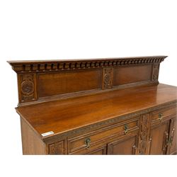 Early 20th century oak sideboard, raised panelled back with foliate carved decoration, rectangular top with gadrooned edge, fitted with two drawers over cupboards with field moulded facias, turned supports joined by stretchers