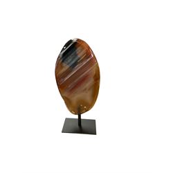 Agate crystal slice, raised on a black metal stand, H16cm