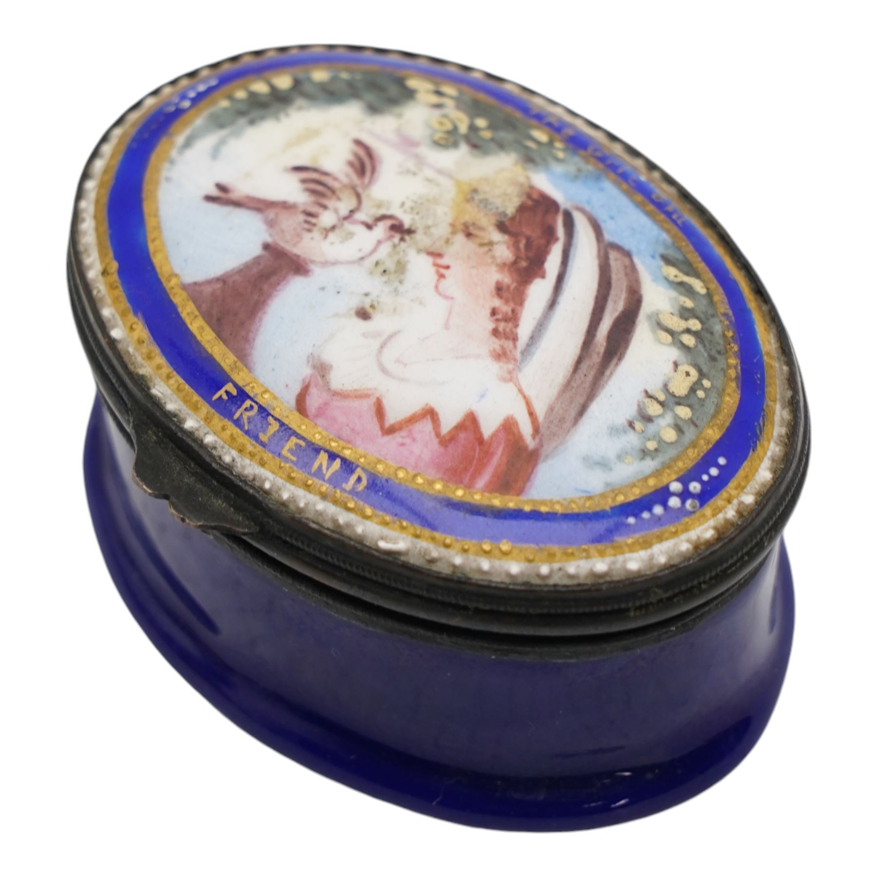 George III South Staffordshire enamel oval patch box, the slightly domed hinged cover painted with an oval portrait of a young girl and dove and inscribed 'The Gift of a Friend', within gilt and white beaded borders, raised upon a blue base, L5cm x H2.5cm 