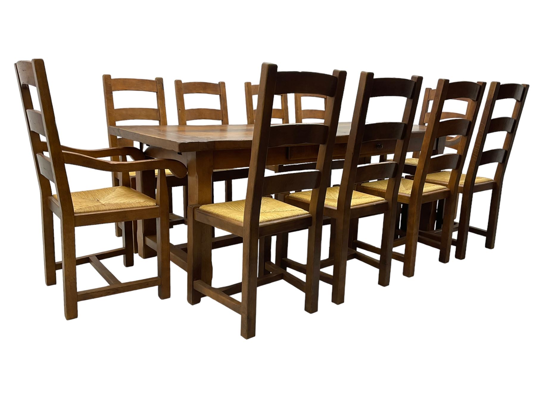 Antix Furniture - oak extending refectory dining table, rectangular plank top with two additional leaves and two drawers to the longer side, on square supports connected by H-stretcher; set of ten (8+2) ladder back dining chairs with rush seats