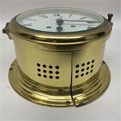 German Schatz Royal Mariner bulkhead ships clock, with an eight-day two-train platform seven-jewel movement, striking the ship's watch on a bell, with bells on/off facility and platform regulation on the 5 inch painted dial, with roman numerals and minute track, in brass case, case D16cm