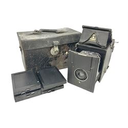 Early 20th century Adams and Co 'Videx' folding plate camera, in original leather carrying case, with various quarter plates