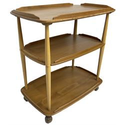 Ercol - mid-20th century light elm 'three tier tea trolley, on castors