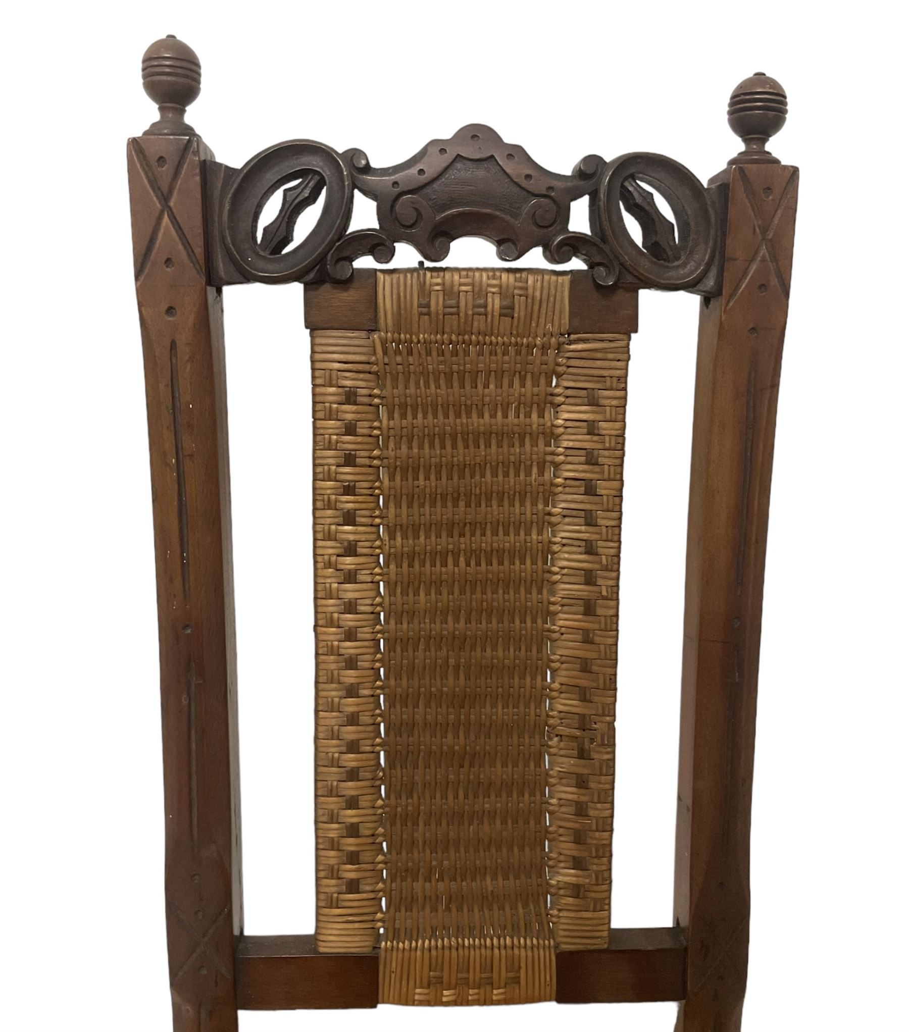 Victorian Aesthetic Movement mahogany framed folding campaign chair, pierced and carved cresting rail with carved and chamfered uprights, rattan back and seat