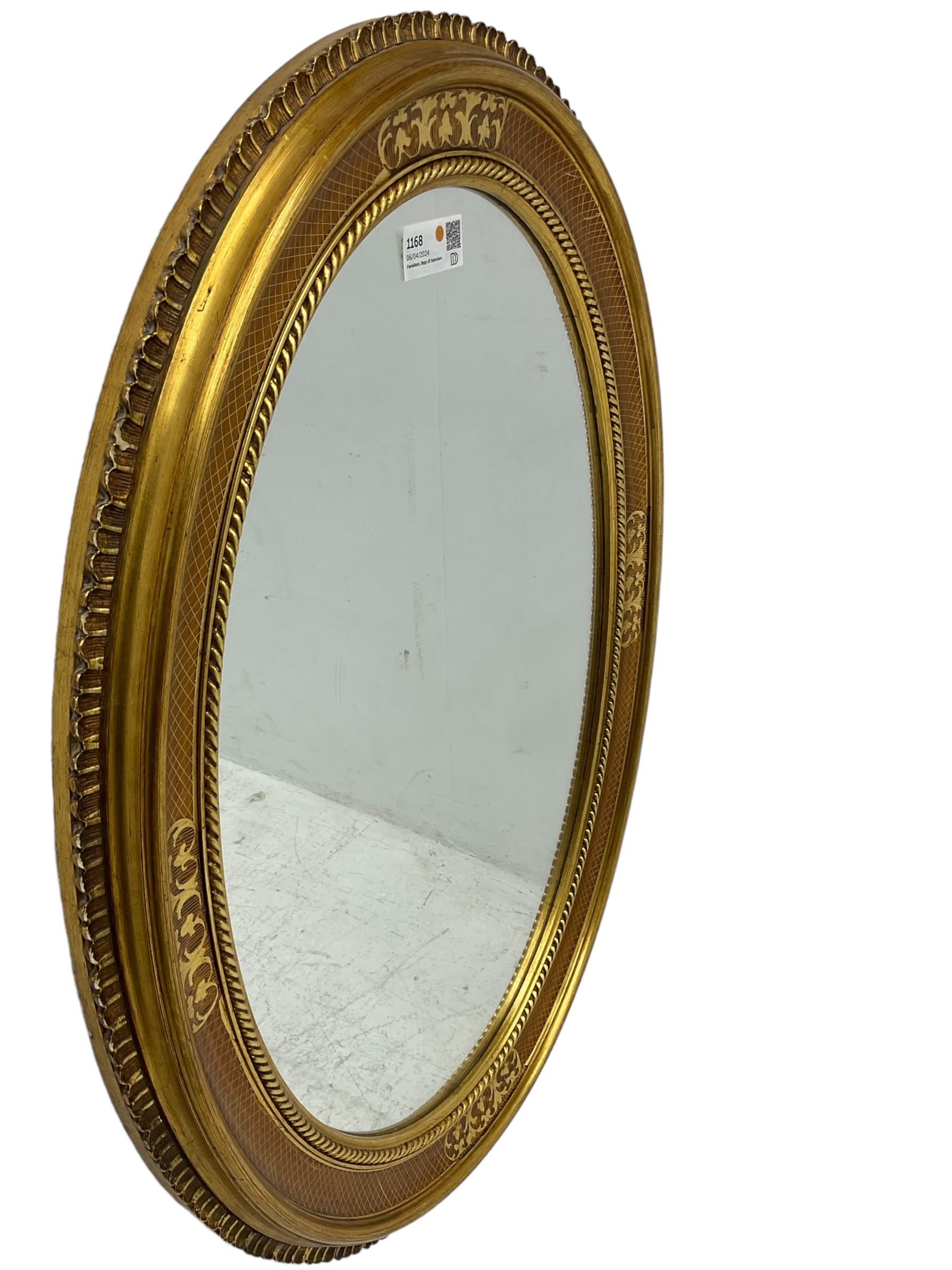 19th century design gilt framed oval wall mirror, shell moulded edge foliate decoration