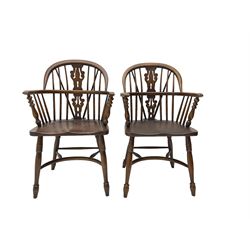 Pair late 20th century oak Windsor elbow chairs, double hoop and stick back with pierced and fretwork work splat, dished seat on turned supports joined by crinoline stretcher 