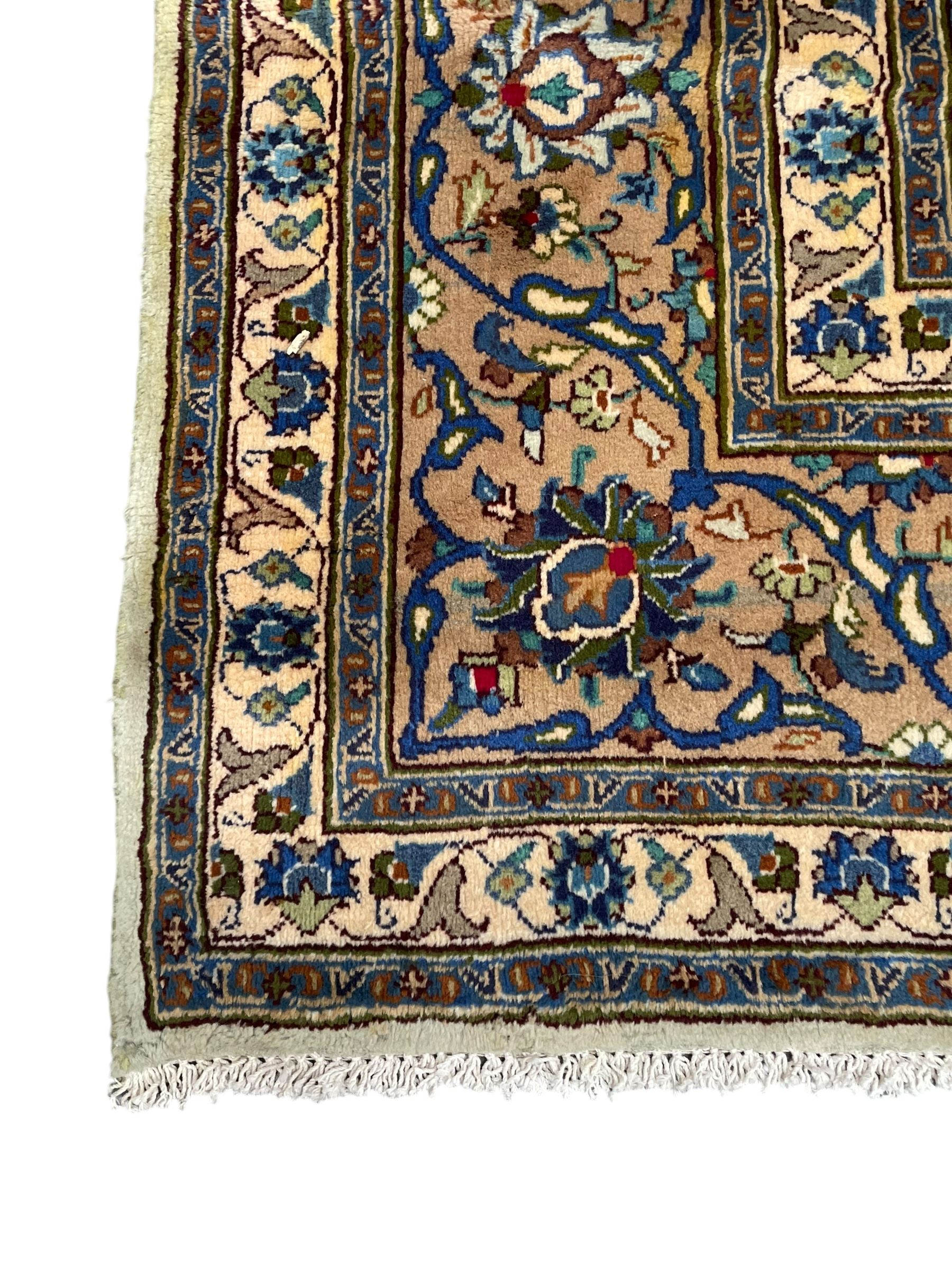 Persian Kashmar pale green ground rug, shaped central medallion decorated with stylised flower heads, the surrounding field with scrolling leafy branches and palmettes, the spandrels and border decorated with further palettes, within floral pattern guard stripes