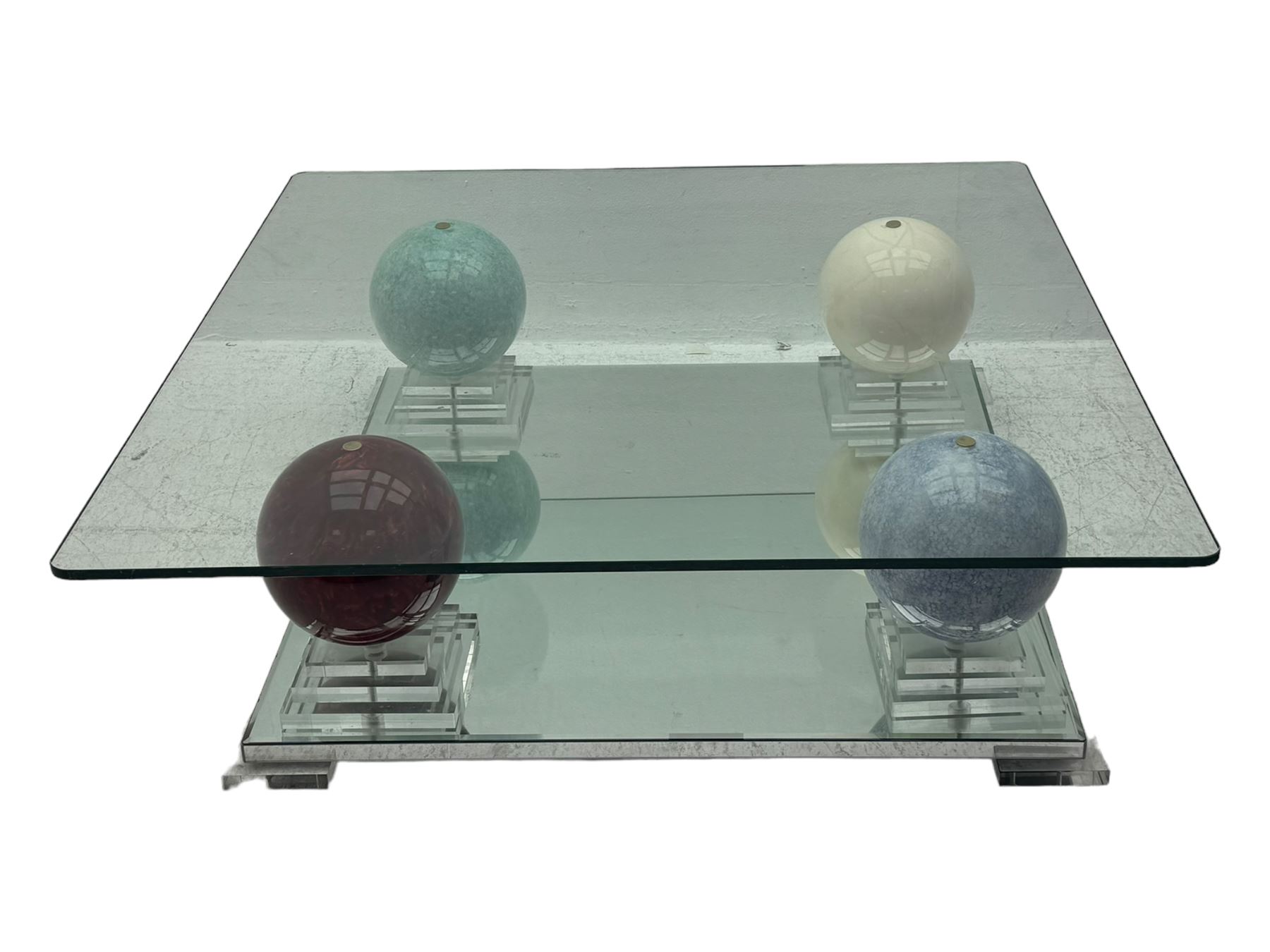 Barker & Stonehouse - contemporary glass coffee table, square top supported by four multicoloured marble spheres, each elevated on layered acrylic pedestal over mirrored base, on square clear supports